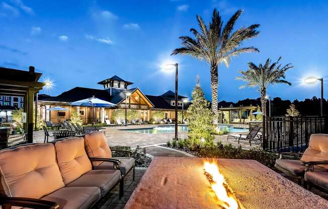 the enclave at green valley ranch fire pits and seating around a pool with palm trees