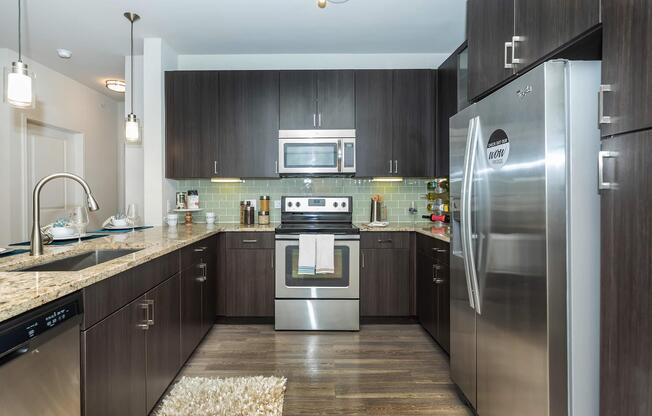 a large kitchen with stainless steel appliances