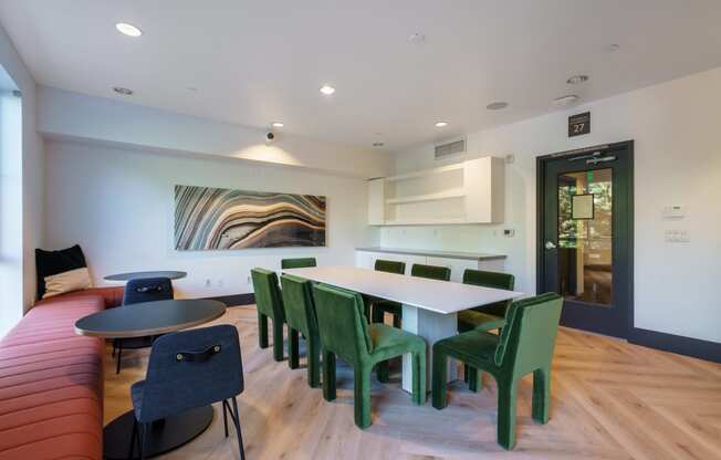 a dining room with a table and chairs and a couch