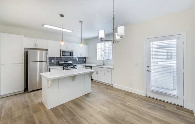 Each unit features a fully updated kitchen with sleek, contemporary amenities, including stainless steel appliances, new cabinetry, and elegant countertops.