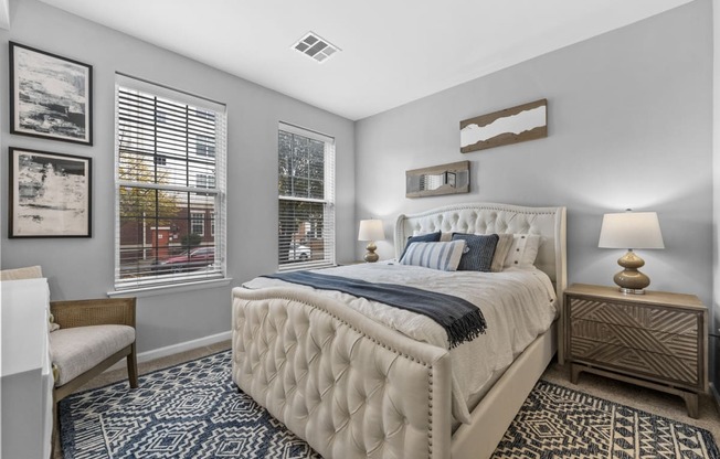 a bedroom with a large bed and two windows  at Harbor Pointe, Bayonne, NJ, 07002