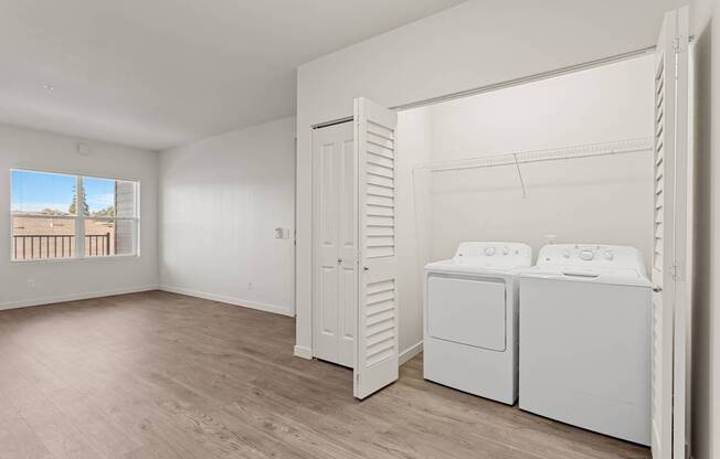 A laundry room with a washer and dryer.