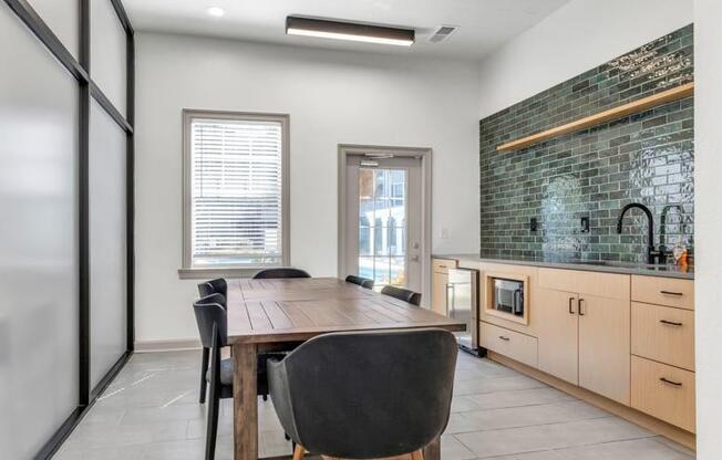 a dining room with a wooden table and black chairs at Marina Point, Chattanooga, TN 37415