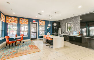 clubhouse kitchen with bar and table seating