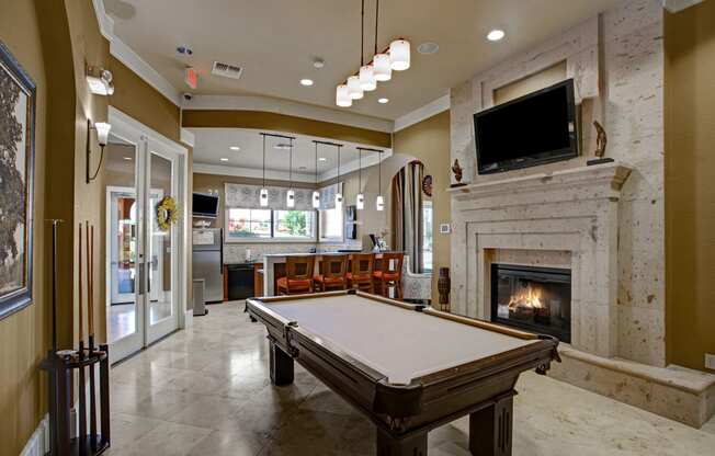 The Palms at Briarwood Resident Lounge with Pool Table and Fireplace Midland Texas Apartments