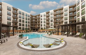 a large swimming pool in front of an apartment building