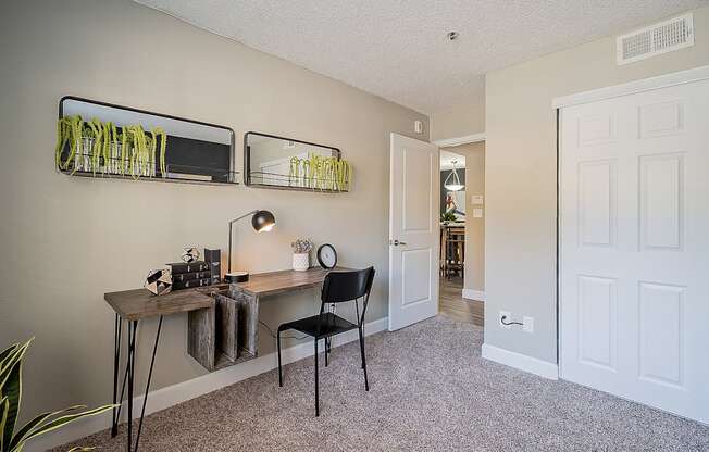 A room with a desk and chair in it at Sterling Point Apartment Homes, Phoenix, Arizona