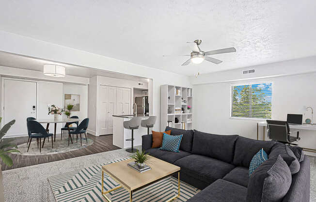 enlarged living room with a couch and coffee table at The Crossings Apartments, Michigan, 49508