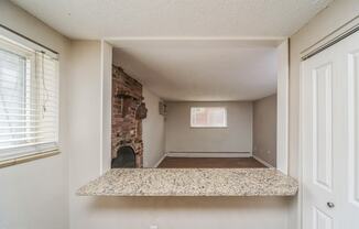 Kitchen with a breakfast bar overlooking the living room