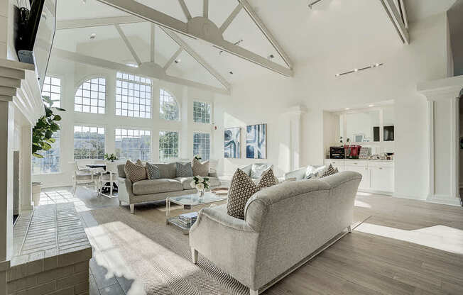 A living room with a couch and a television.