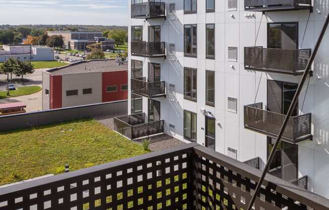 a view of an apartment building from a balcony at Maven on Broadway, Minnesota, 55904