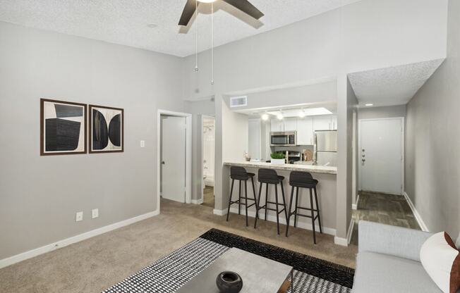 a view of a dining room with a table and chairs