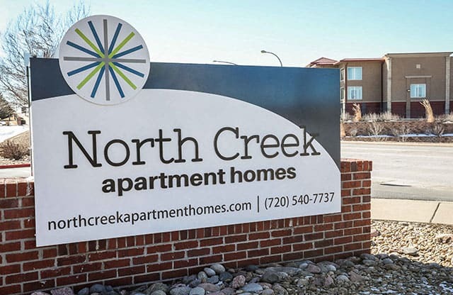 North Creek Apartments - Front Entrance Sign on Brick Base