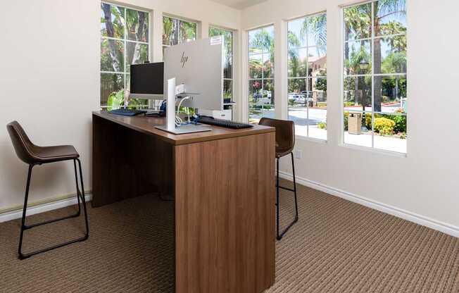 A room with a desk and a chair.