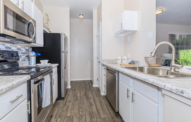 a kitchen with a stove and a sink