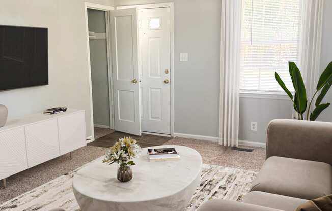 a living room with couches and a coffee table