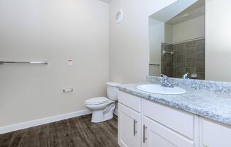 Apartments in Leander TX - Hills at Leander Expansive Bathroom with a Large Vanity, Shower, and Much More