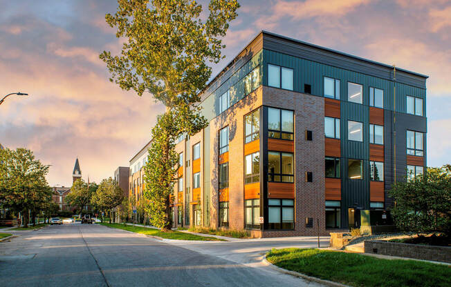 a modern building with a street in front of it at Canary Lofts, Des Moines