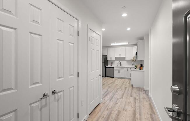 a kitchen with a sink and a mirror
