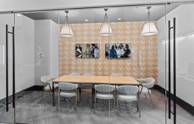 a dining room with a wooden table and chairs