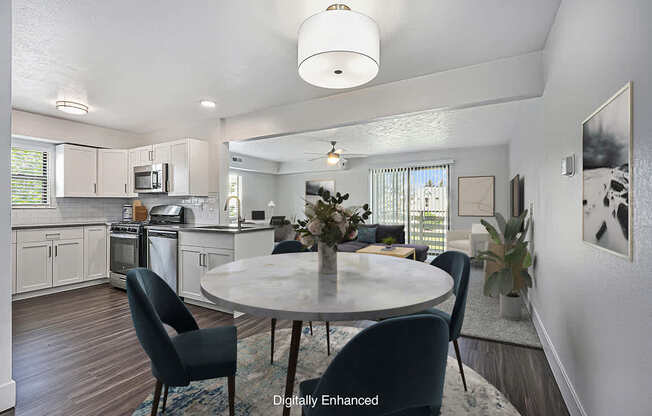 A modern kitchen with a dining table set for four.
