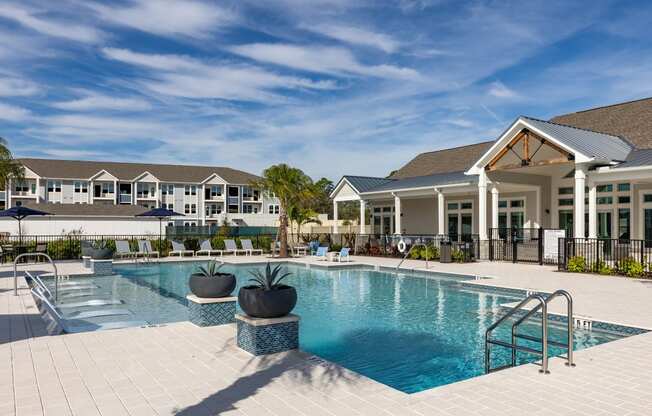 a swimming pool with a building in the background