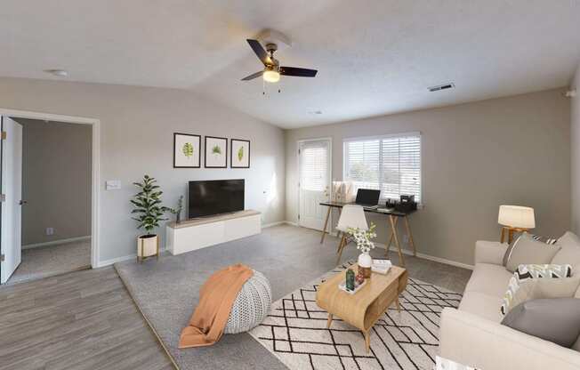 Spacious and airy living area in a top unit with vaulted ceilings and a large window.