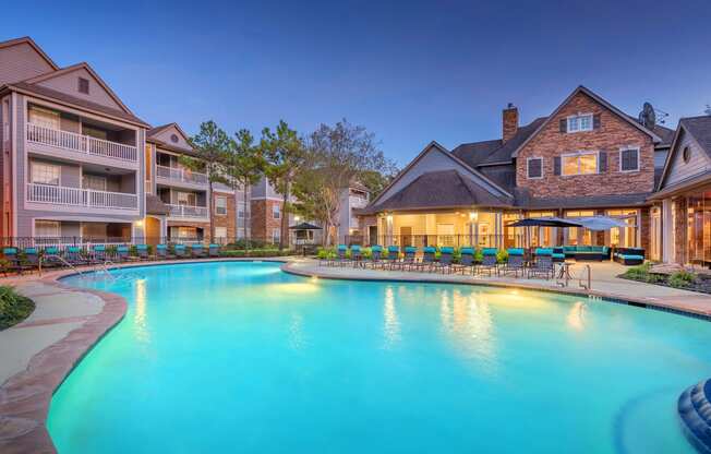 Lodge at Cypresswood Apartments - Pool with sundeck at twilight