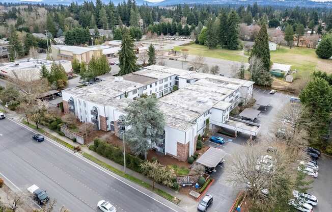 an aerial view of an office building with a large metal roof