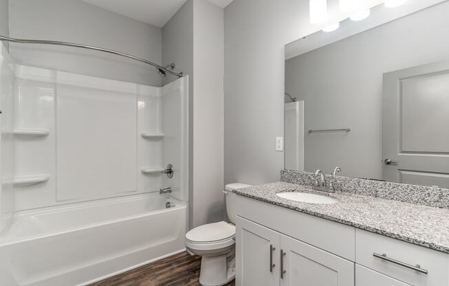 Bathroom with a bathtub toilet and sink at The Parker Myrtle Beach, South Carolina