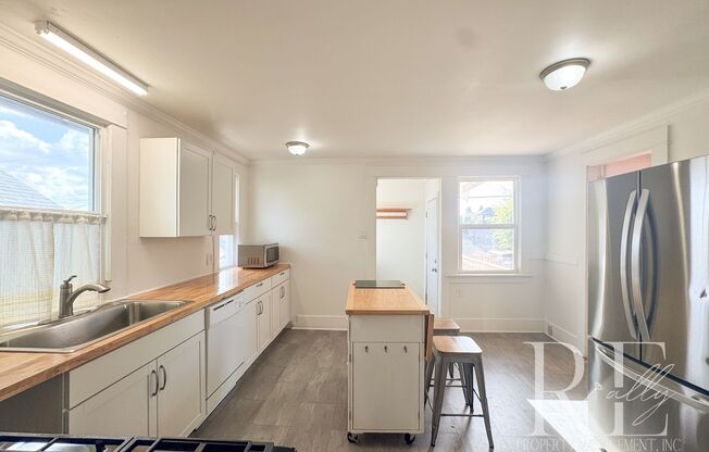 Light-Filled Home with Vaulted Ceilings, Bonus Basement & Walkable Location