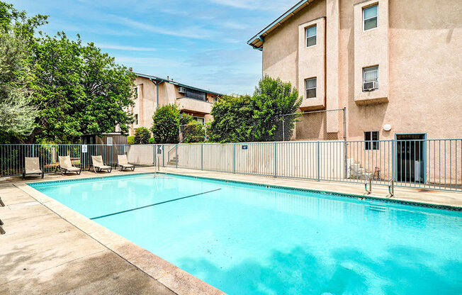 Beautiful community pool with lounging area.