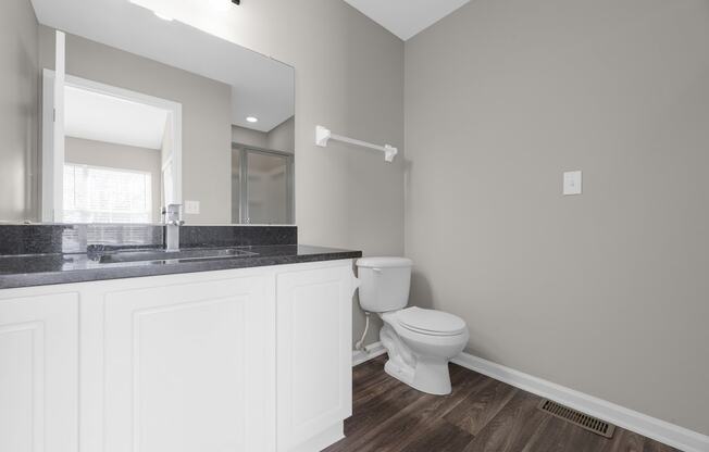 an empty bathroom with a toilet and a sink at Traditions at Slate Ridge, Reynoldsburg Ohio