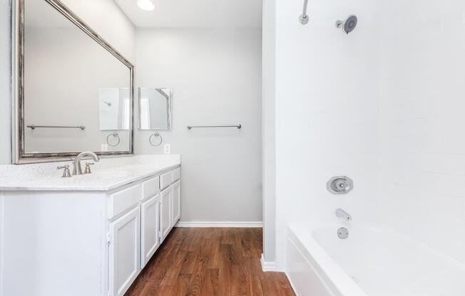 a room with a sink and a mirror