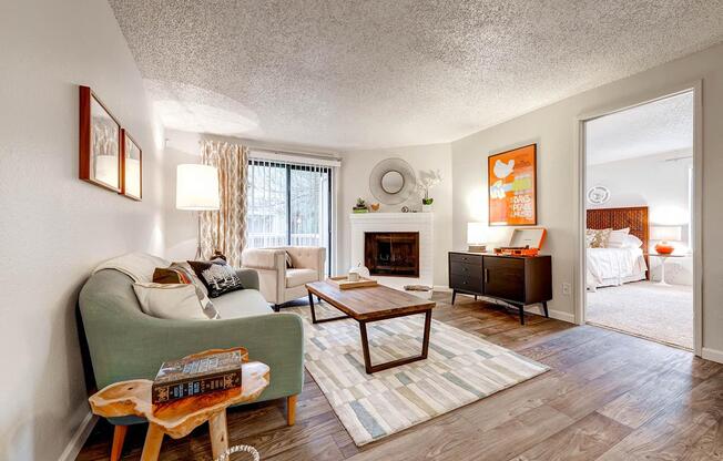 Living Room with sliding patio doors, fireplace and view into the master bedroom