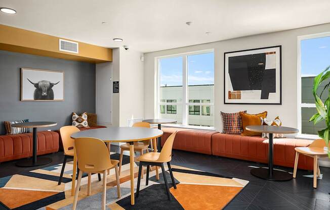 A modern dining room with a large table and chairs.