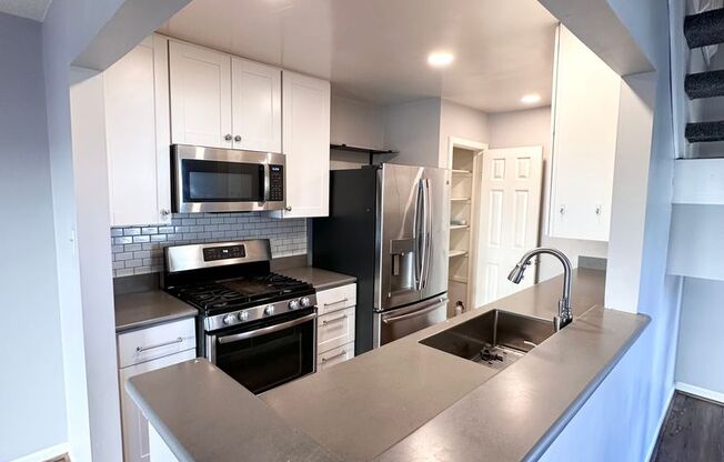 4-Bedroom End-Unit Townhome with Spacious Yard & Outdoor Oasis!