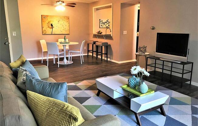 Large modern living room with adjacent dining room at Camelot East Apartments, Ohio, 45014