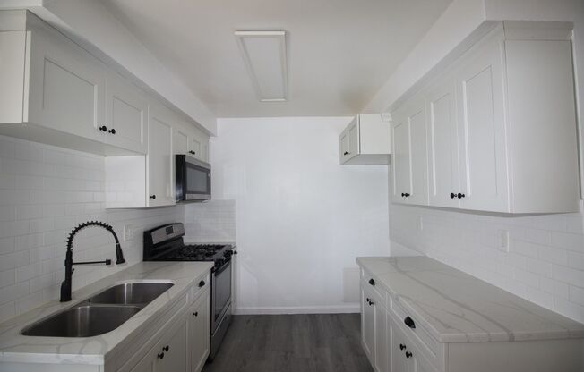 7121 WOODMAN AVE.