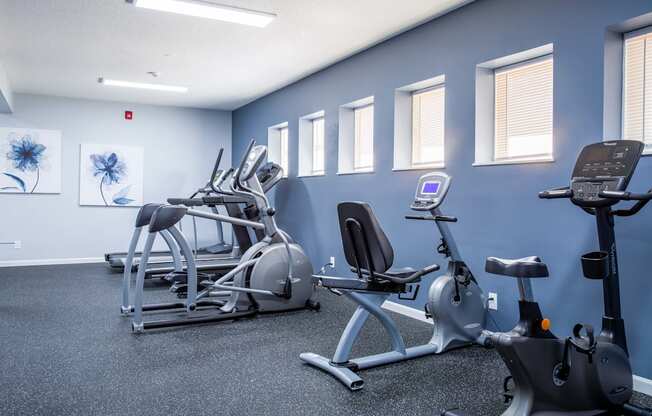 a gym with various exercise equipment in a building