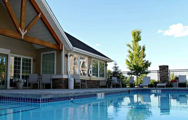 a swimming pool in front of country vista clubhouse with a resort style pool