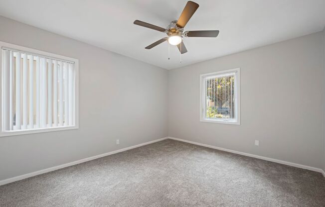 Baldwin Village CA Apartments - Gloria Homes - Spacious Bedroom with Plush Carpeting