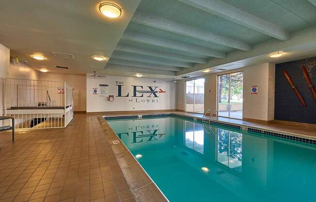 A large indoor swimming pool with the word