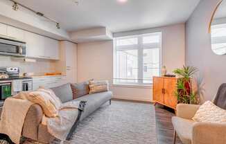 a living room with a couch and two chairs