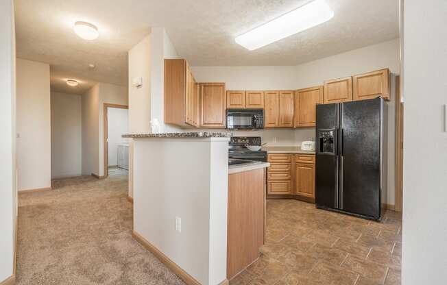 Large kitchen with side-by-side fridge at Stone Ridge Estates townhomes in south Lincoln NE