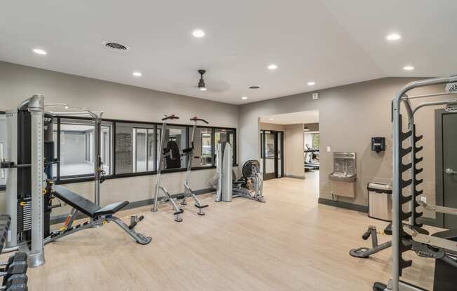 Renovated fitness center with cardio and strength training at The Waverly, Belleville, MI, 48111