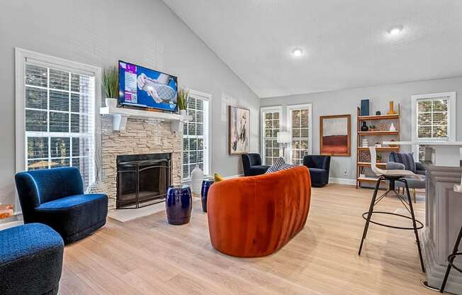 a living room with a fireplace and a tv above it