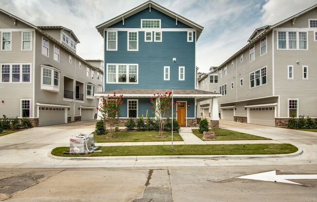 Welcome to a beautiful Craftsman-style Townhome