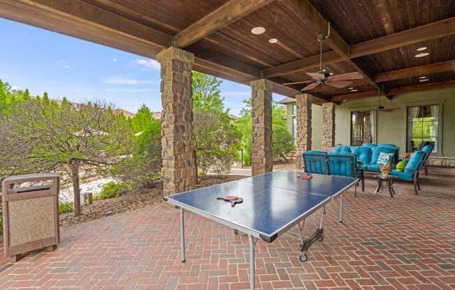 ping pong table and lounge area by the pool