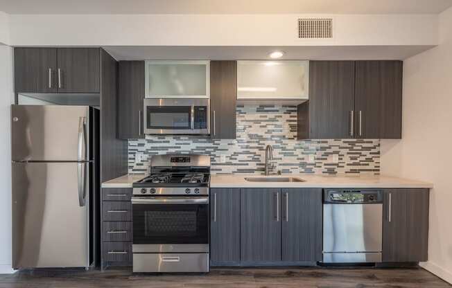 a kitchen with stainless steel appliances and a counter top